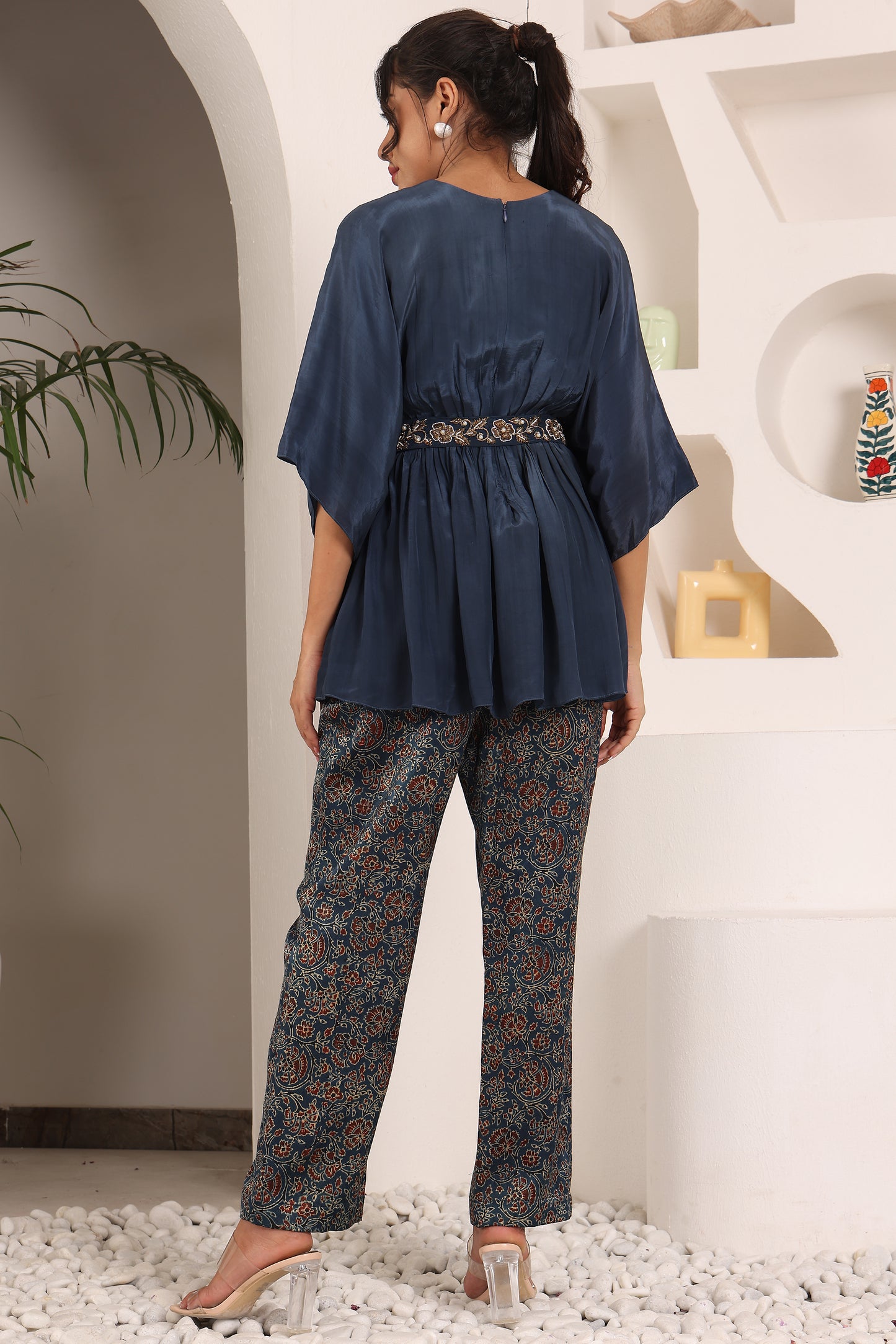 Blue pleated top with ajrakh pants and belt