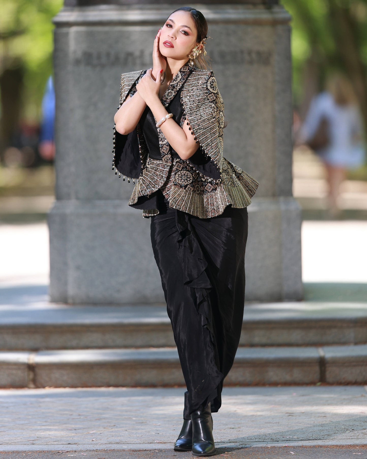 Black paplum top with drape skirt