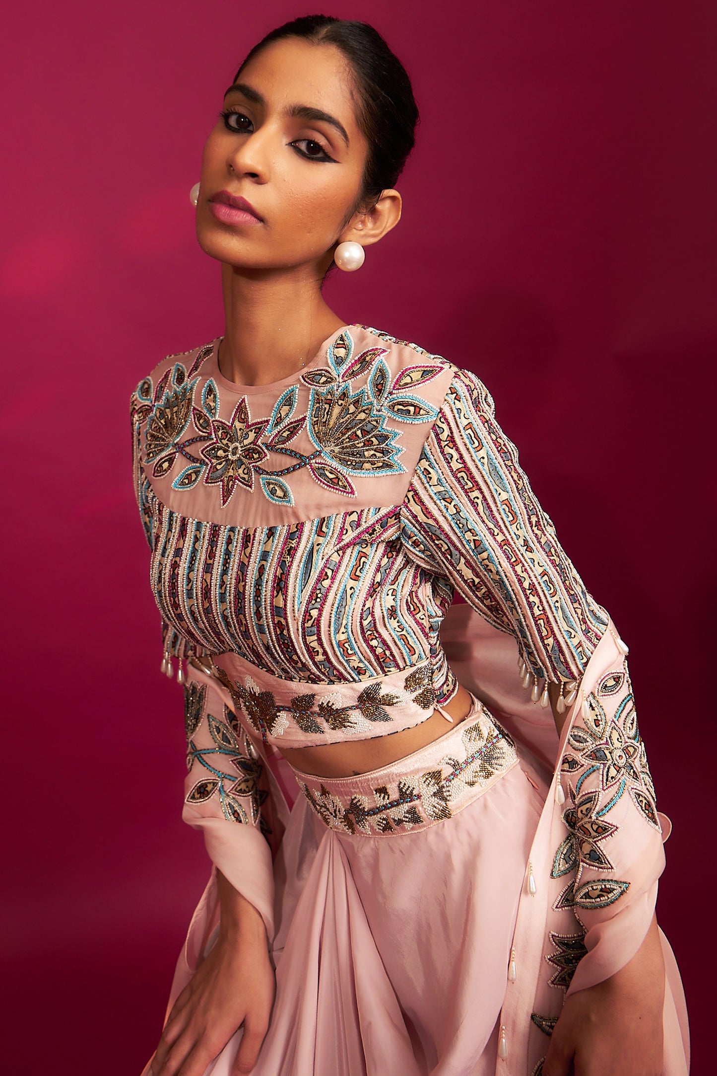 Peachy pink embellished ajrakh blouse with embroidered cape and dhoti