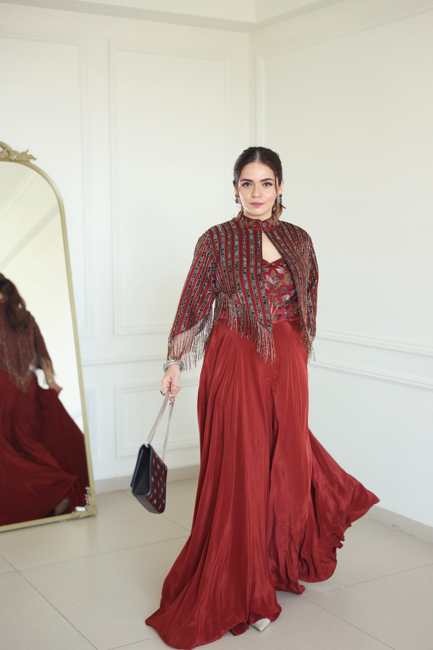 Heena Somani in Agatha Maroon jumpsuit with cape jacket