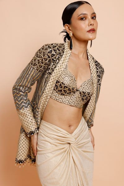 Woman wearing a patterned outfit on a beige background
