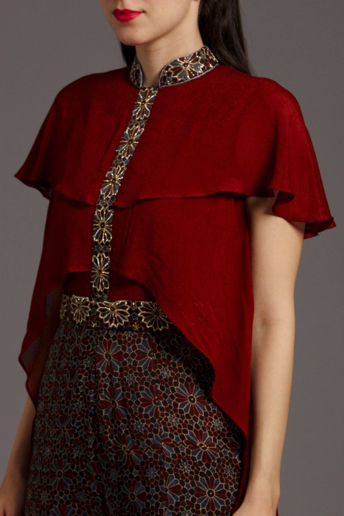 "Chic Jumpsuit in Pure Modal Silk Ajrakh with Layered Yoke Pattern in Crepe, featuring Intricate Embroidery on Waistband and Strip. Elevate your style!"