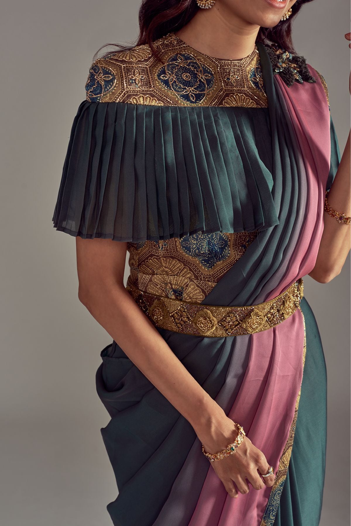 "Mesmerizing Shaded Olive Green Gown Saree with Ajrakh Print Mashru Silk Blouse, adorned with Work Detailing, and a Stunning Intricately Embroidered Belt."