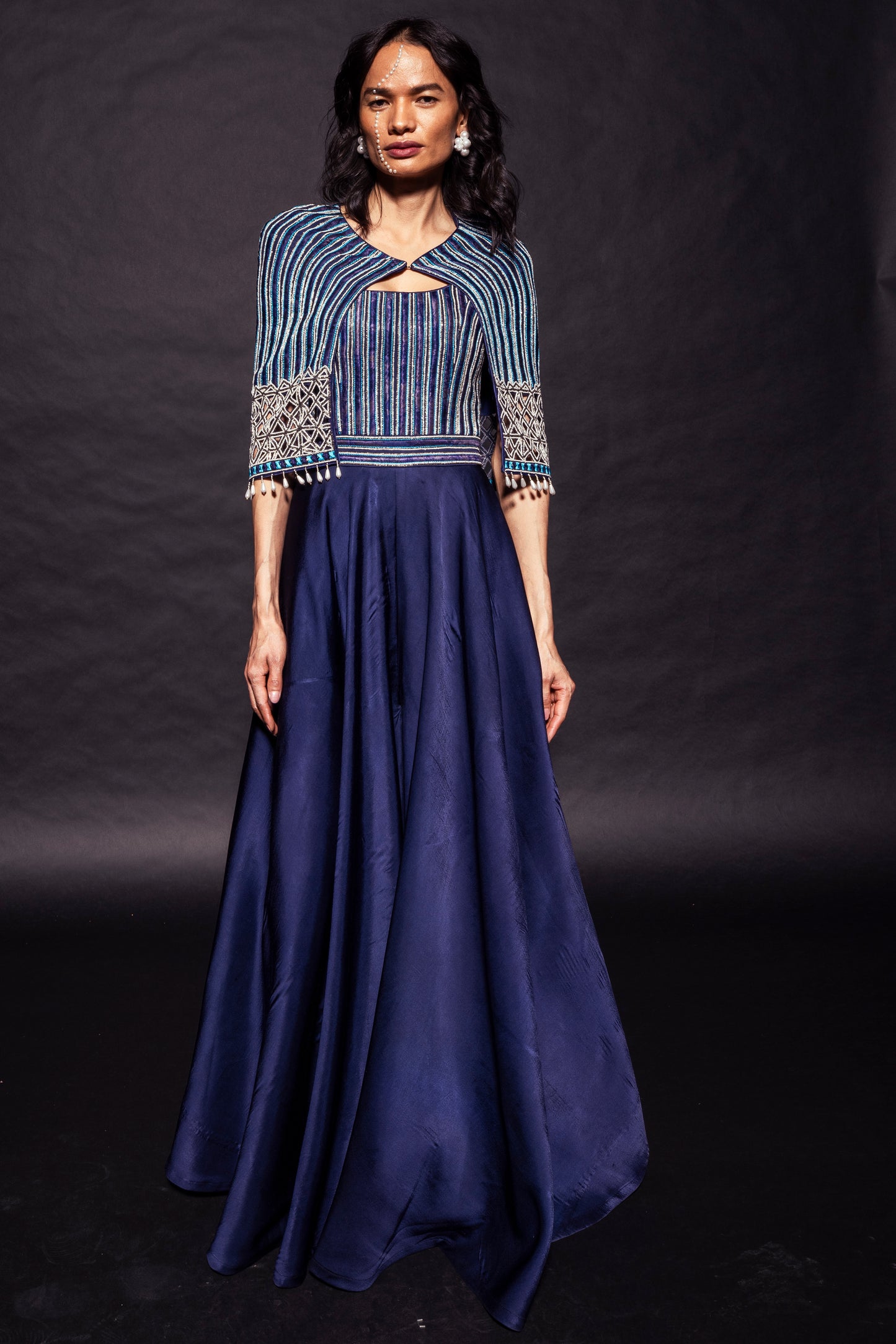 Deep blue ajrakh embellished jumpsuit with fully embsllished ajrakh stripwork cape jacket
