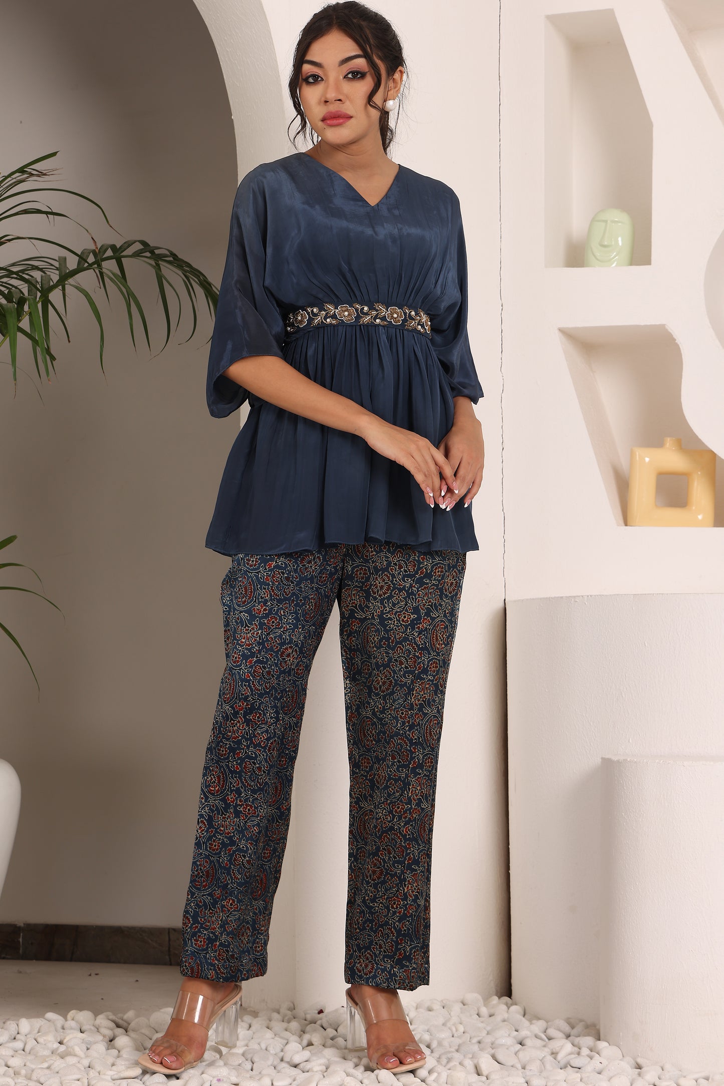 Blue pleated top with ajrakh pants and belt