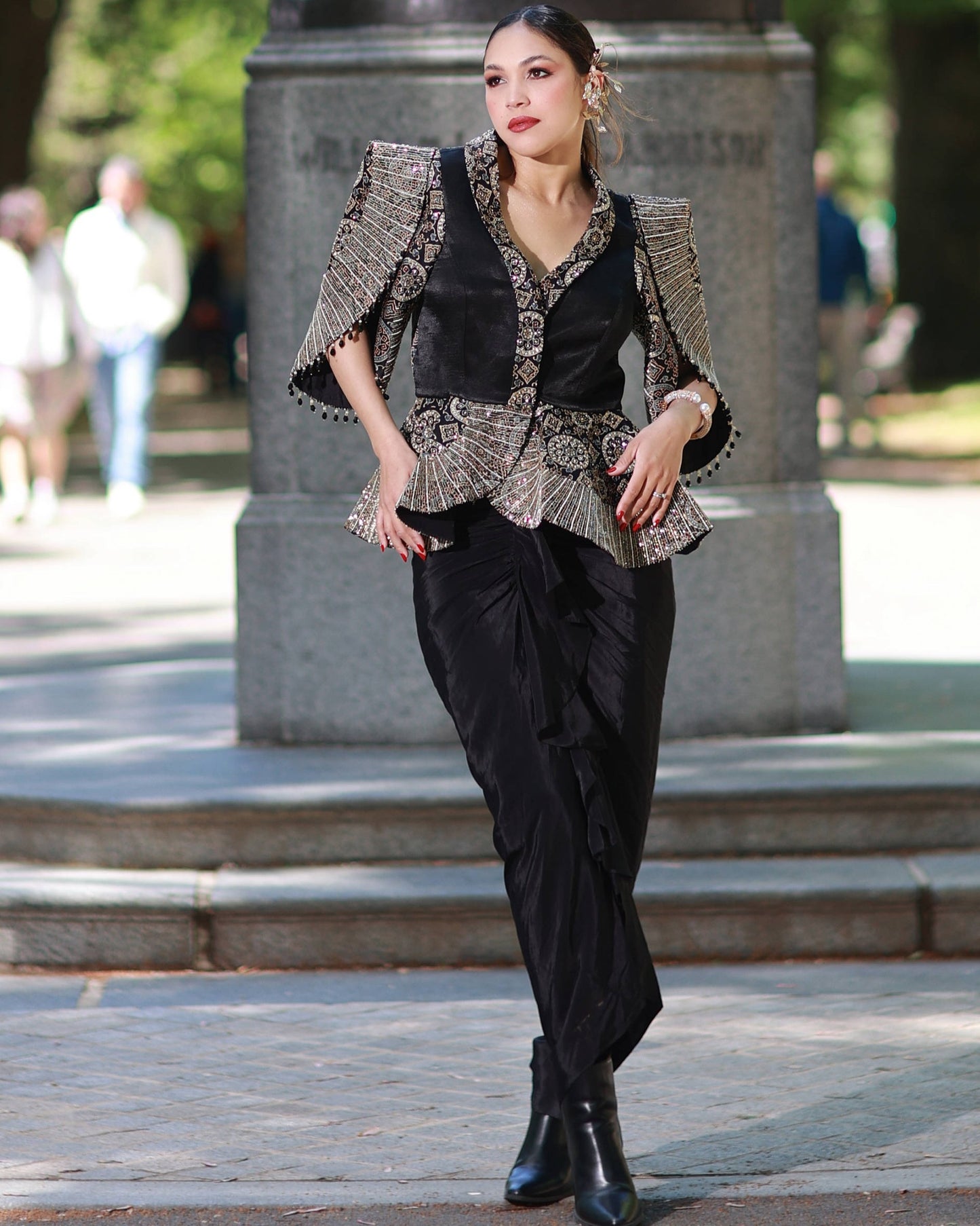 Black paplum top with drape skirt