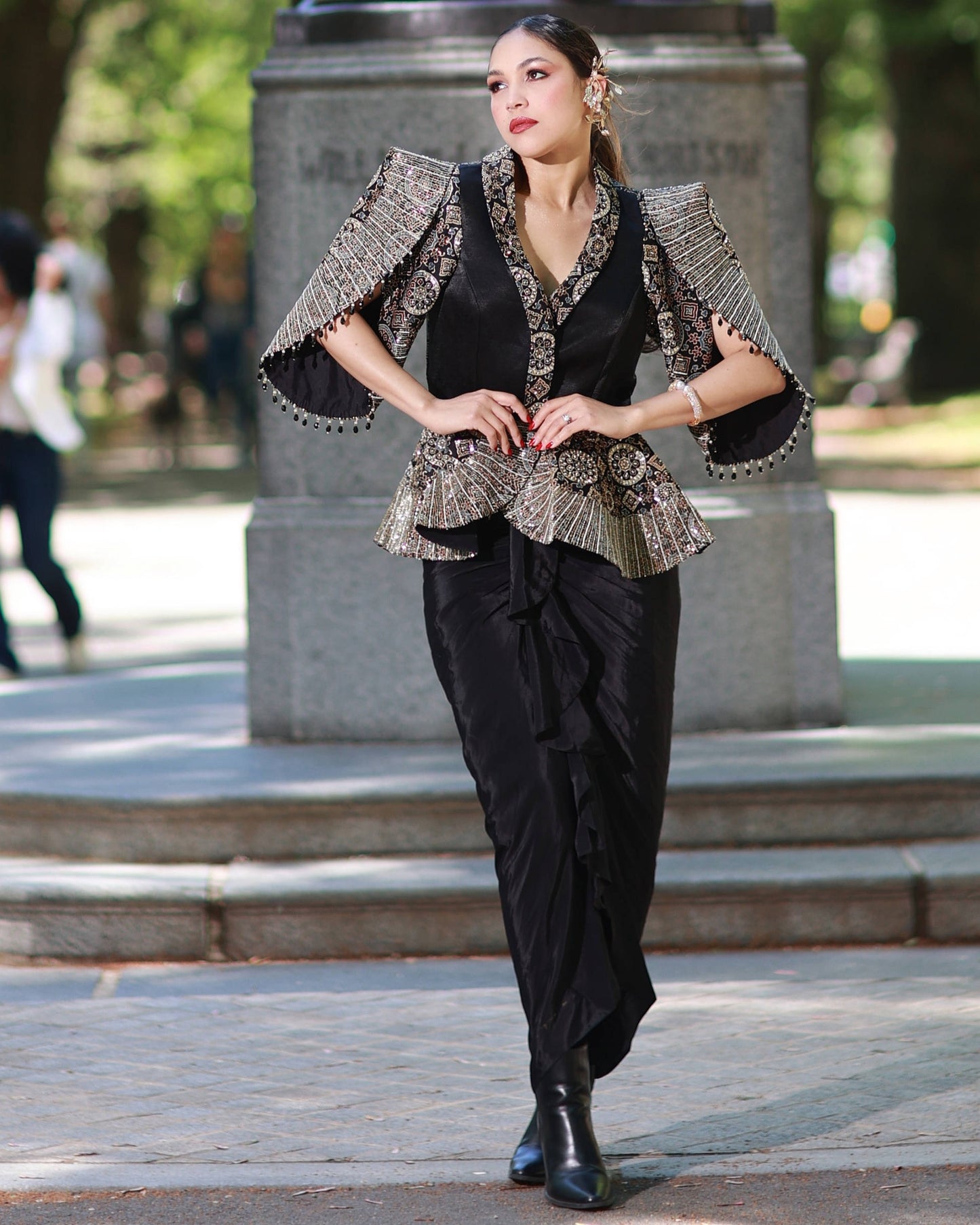 Black paplum top with drape skirt