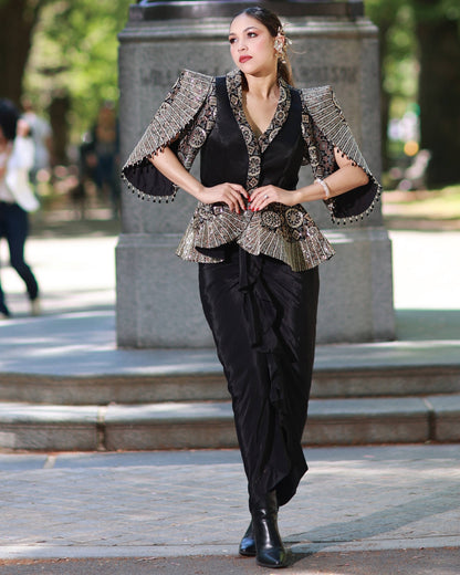 Black paplum top with drape skirt