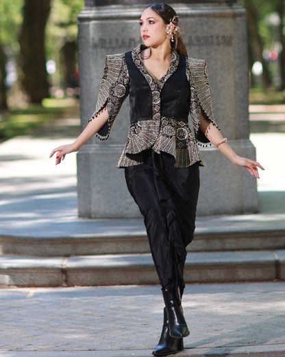 Black paplum top with drape skirt