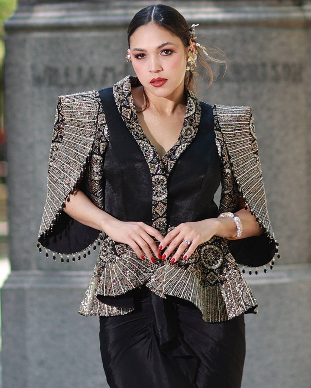 Black paplum top with drape skirt