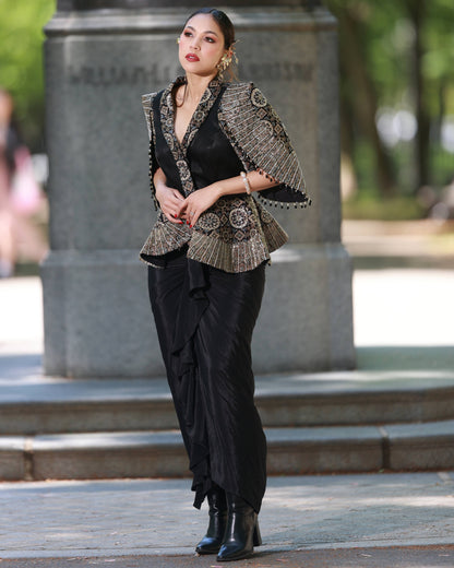 Black paplum top with drape skirt