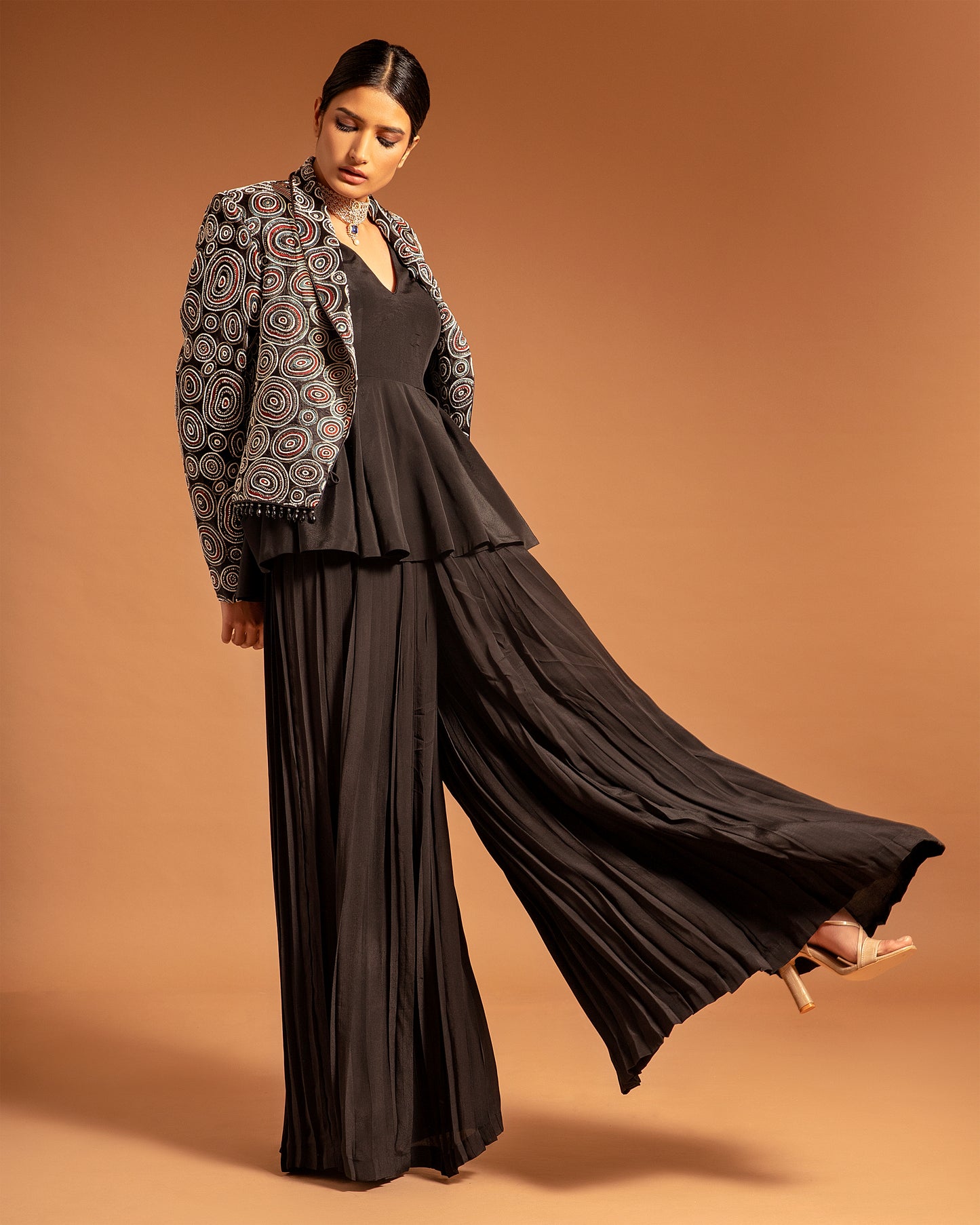 Black Ajrakh embellished jacket with black peplum top and pleated pants