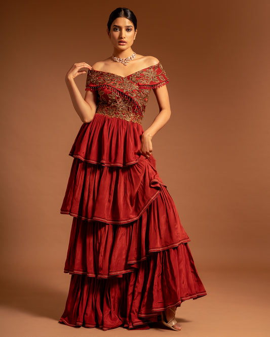 Maroon off shoulder layered Gown.