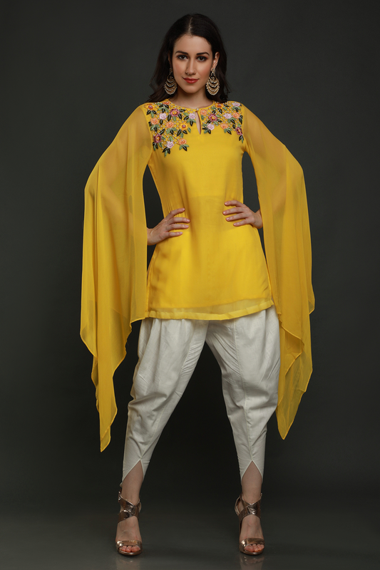 "Radiant Mango Yellow Georgette Kurta with Flared Sleeves, paired with White Dhoti adorned with Intricate Thread, Bead, and Cut Dana Embroidery."