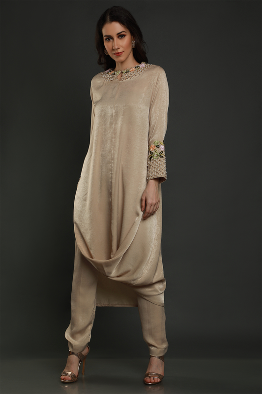"Elevate your style with our Sand Beige Velvet Crepe Drape Tunic & Pants Set. Hand-embroidered with exquisite details. Perfect for any occasion."