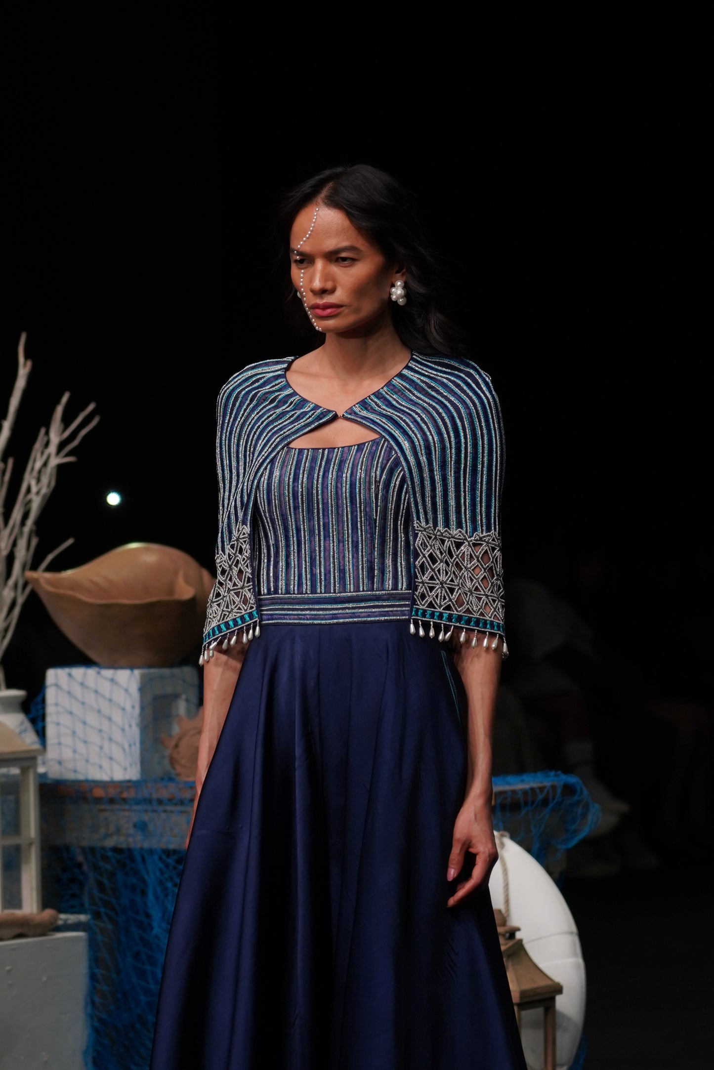 Deep blue ajrakh embellished jumpsuit with fully embsllished ajrakh stripwork cape jacket