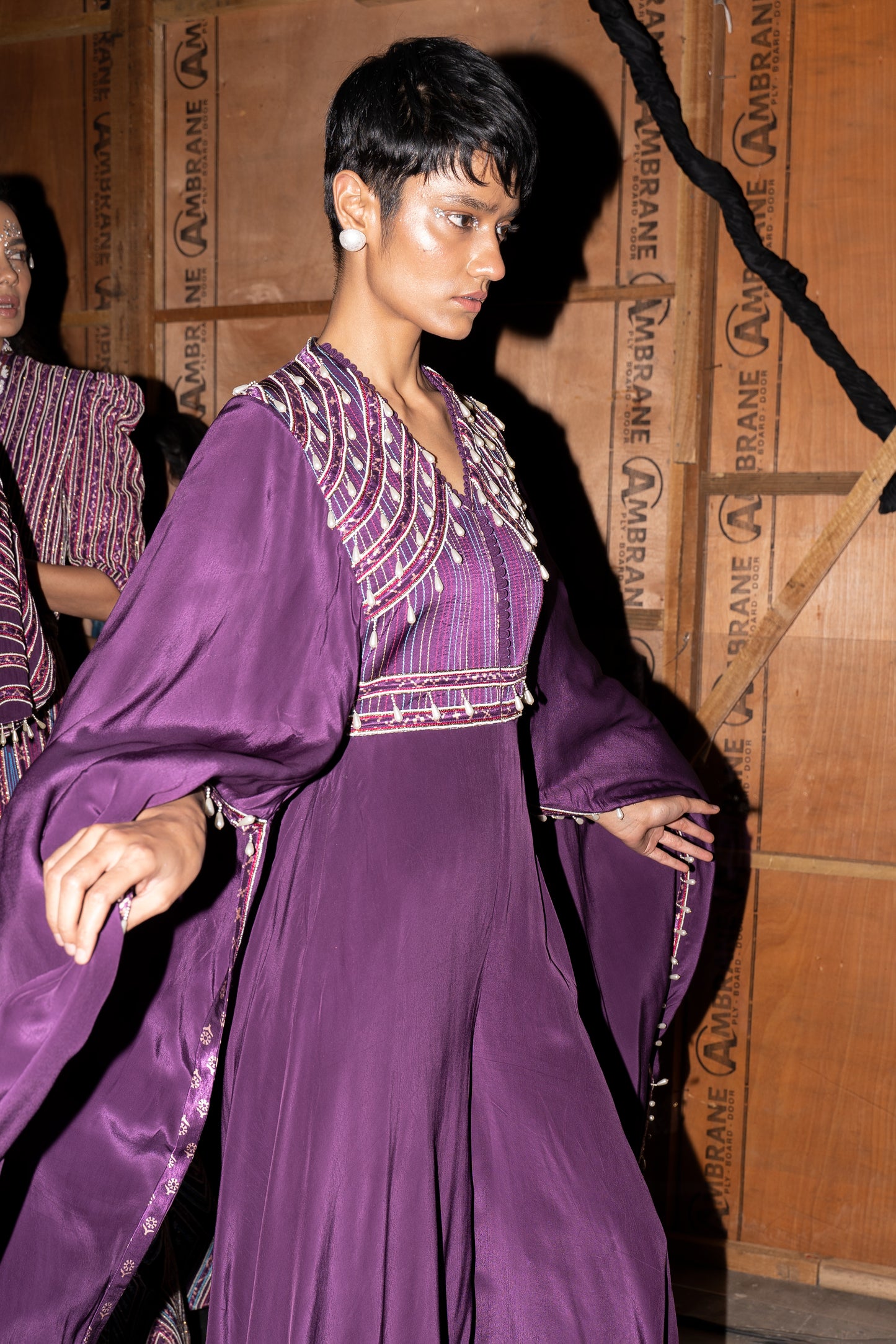 Purple heavily embellished jumpsuit wiwth embroidered cape sleeves