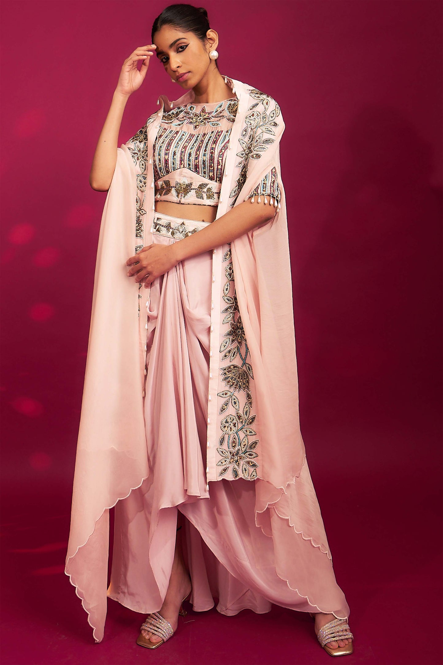 Peachy pink embellished ajrakh blouse with embroidered cape and dhoti