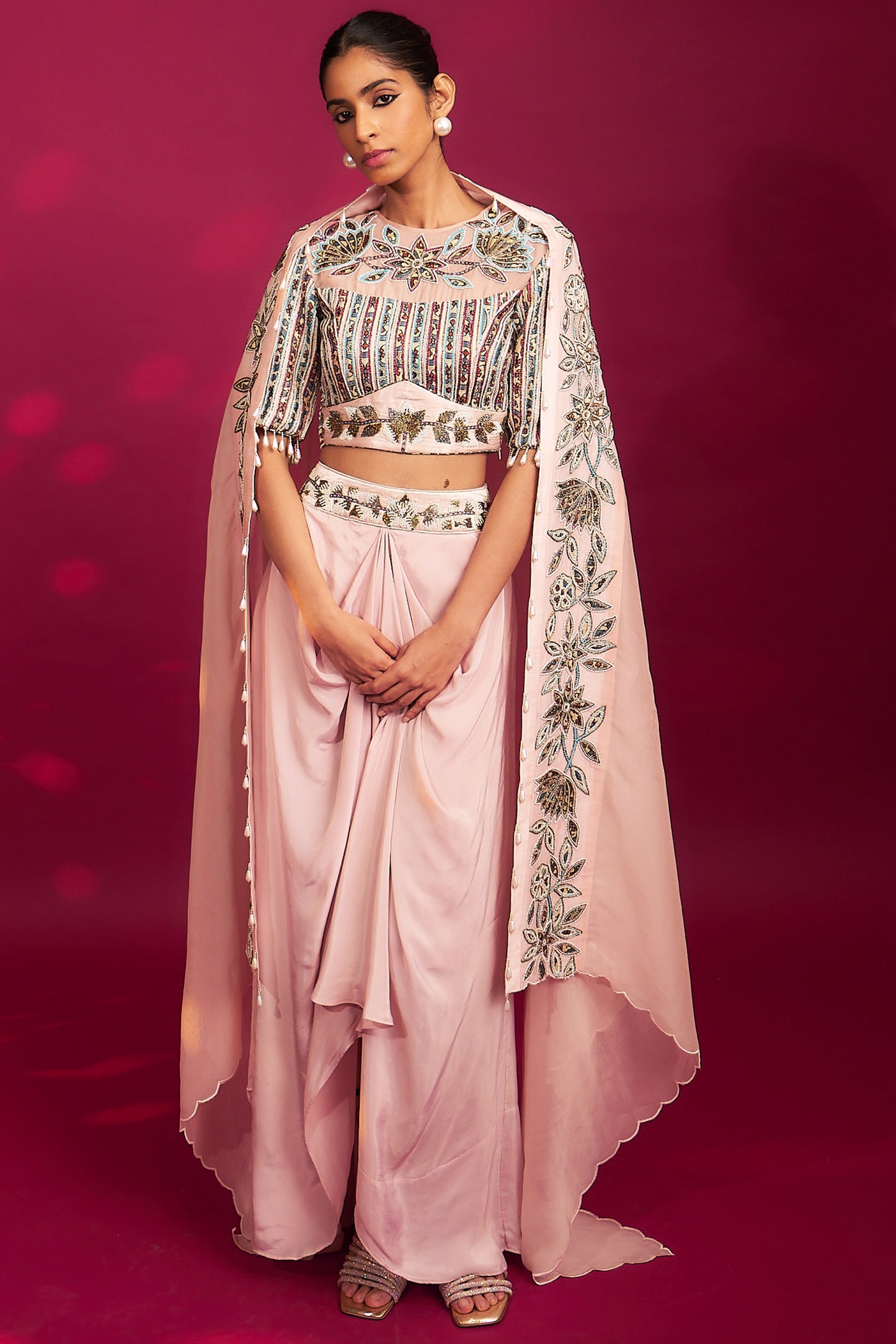 Peachy pink embellished ajrakh blouse with embroidered cape and dhoti