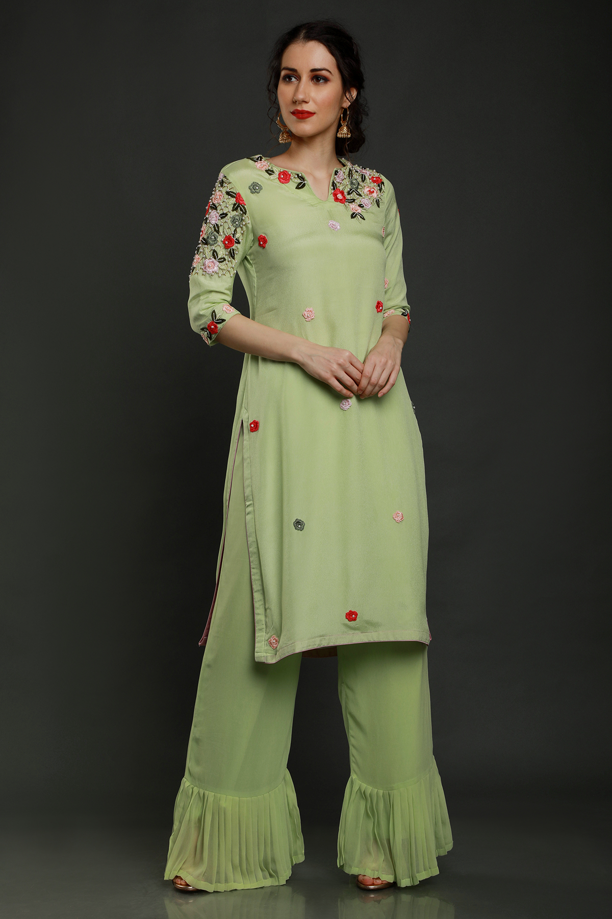 "Stylish crepe mint green kurta paired with pleated palazzo pants & shaded dupatta adorned with intricate threadwork, pearl beads & cutdana - Elegant ensemble!"