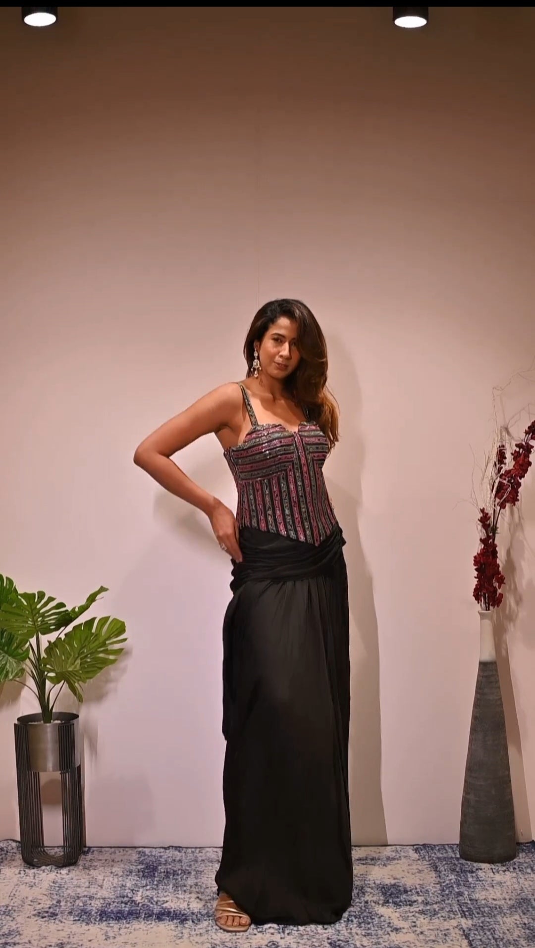 Nikki Deol in Black Embellished Short Jacket and corset with  Draped Skirt Set