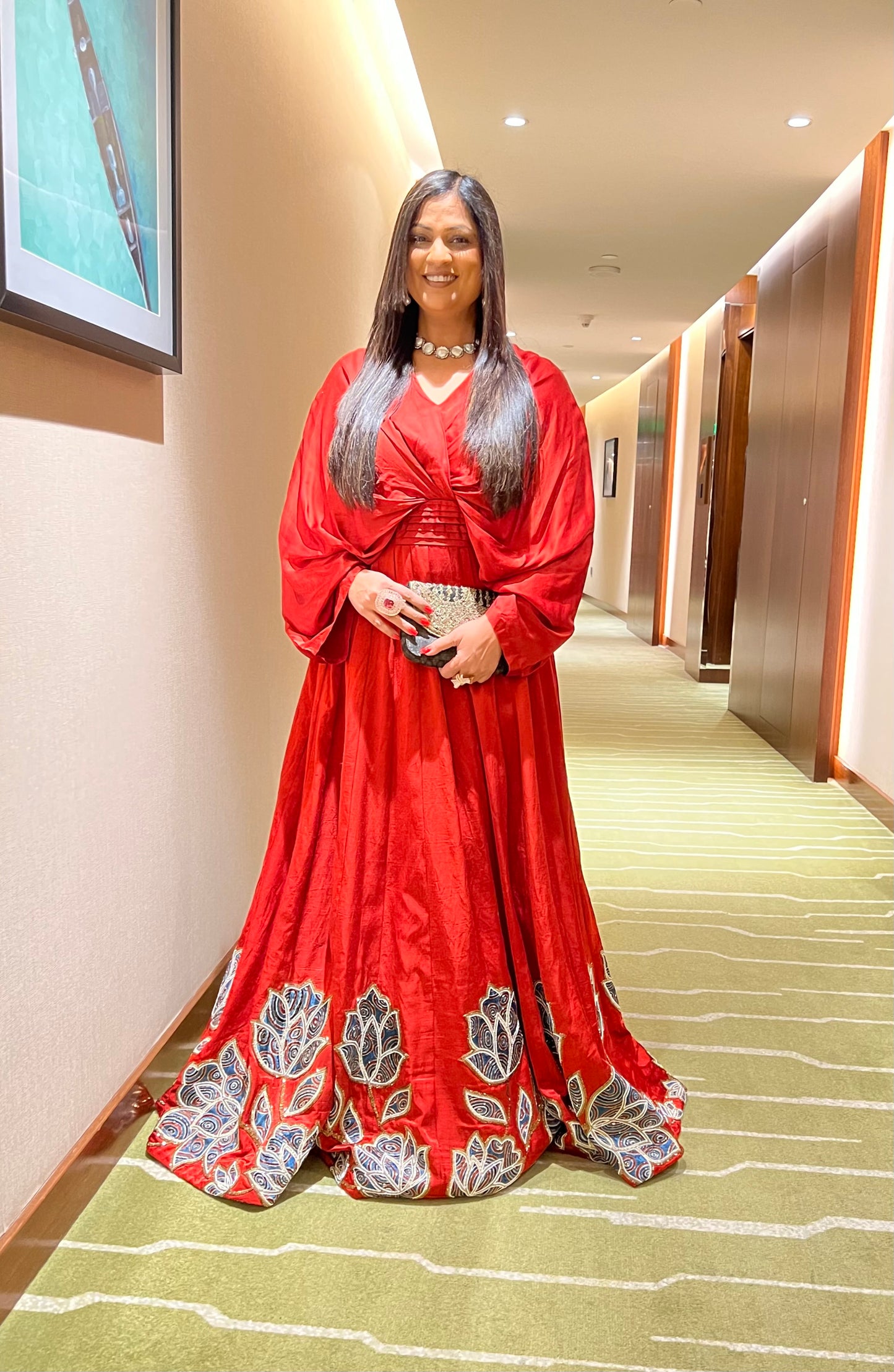 Richa Sharma in Red Poncho sleeve patchworked Gown with Belt