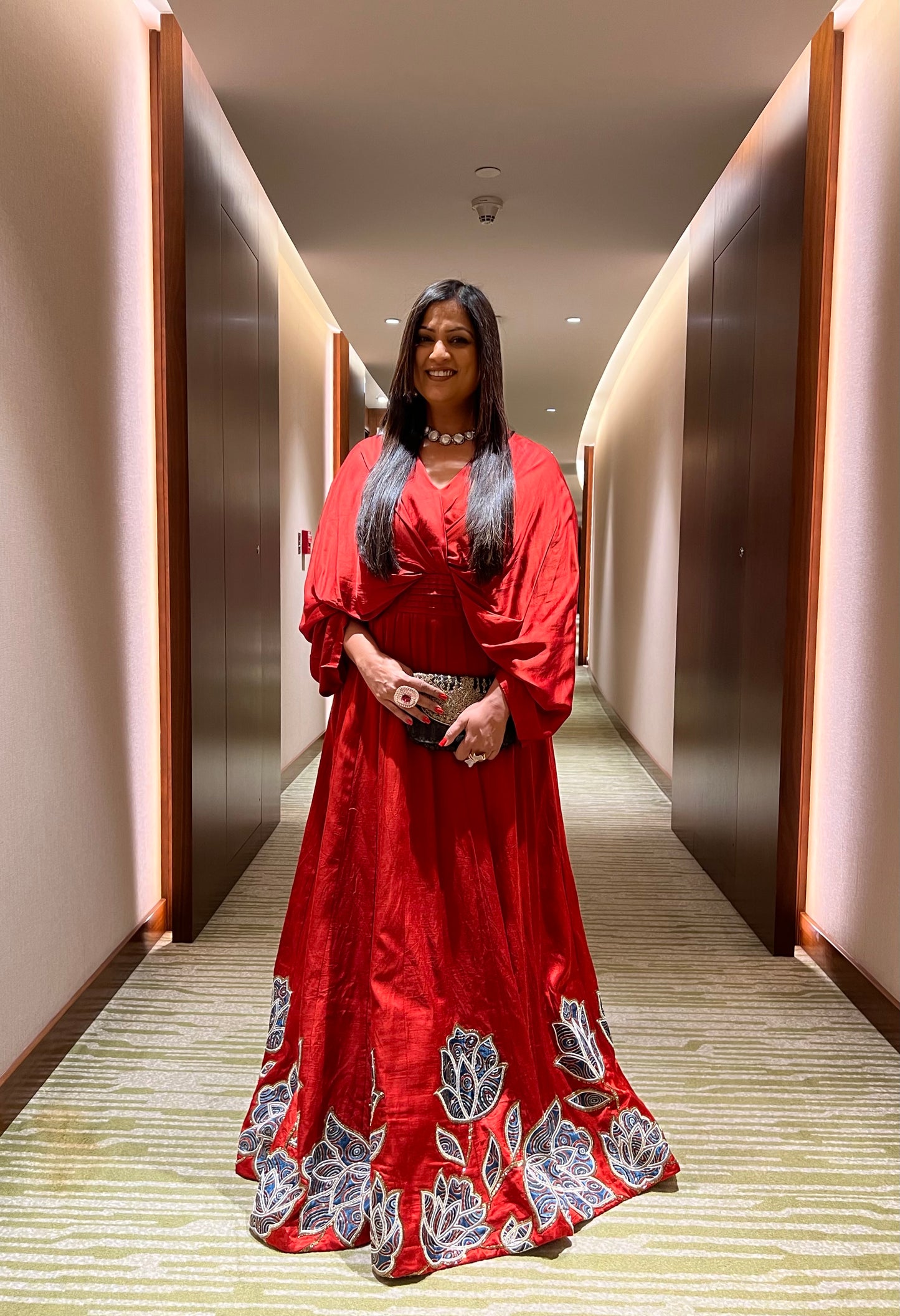 Richa Sharma in Red Poncho sleeve patchworked Gown with Belt