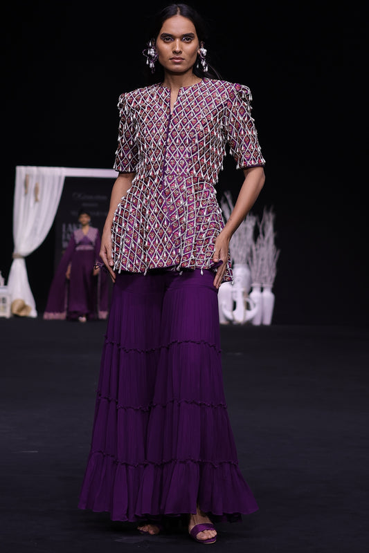 Purple fully embellished ajrakh peplum top with tiered sharara set