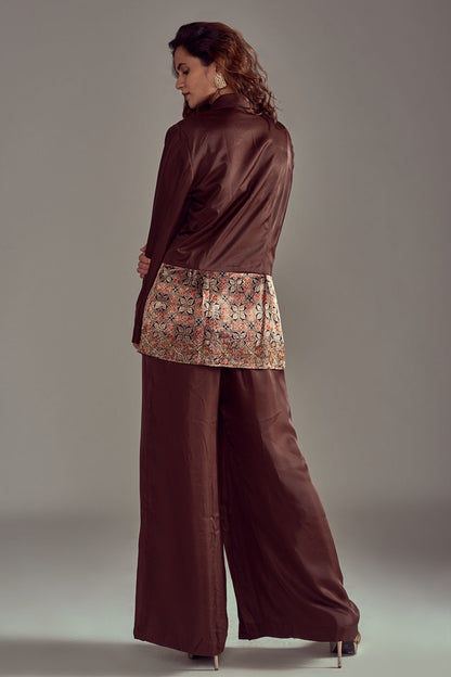 Step into elegance with a Peplum Chocolate Brown Blazer in Pure Mashru Silk, adorned with Ajrakh work. Perfectly paired with Chocolate Brown Pants in Mashru Silk