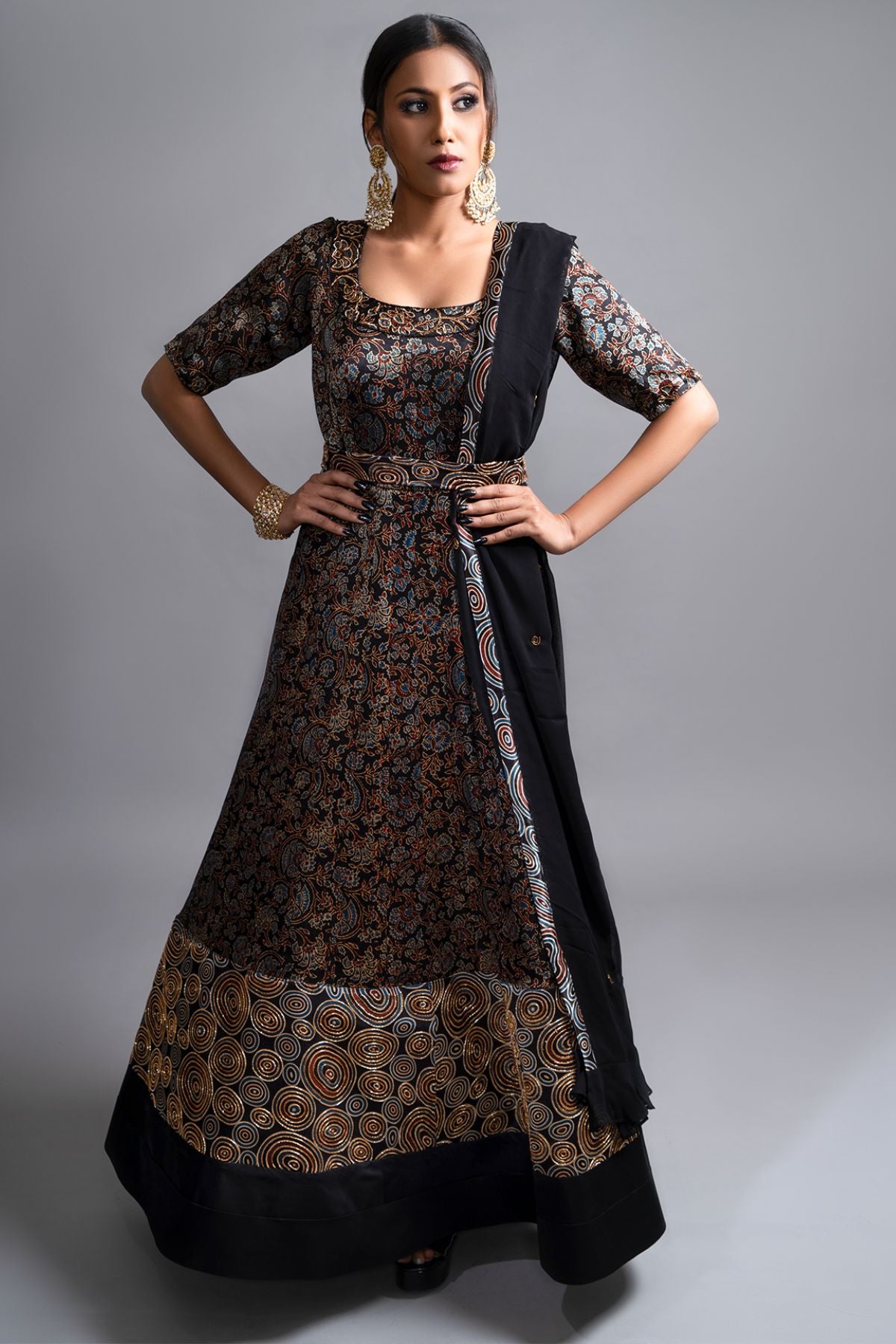"Stunning Anarkali in Pure Mashru Silk Ajrak Print, featuring an Organza Dupatta. Exquisite Nakshi and Zardosi Embroidery adorn the Panel and Yoke."