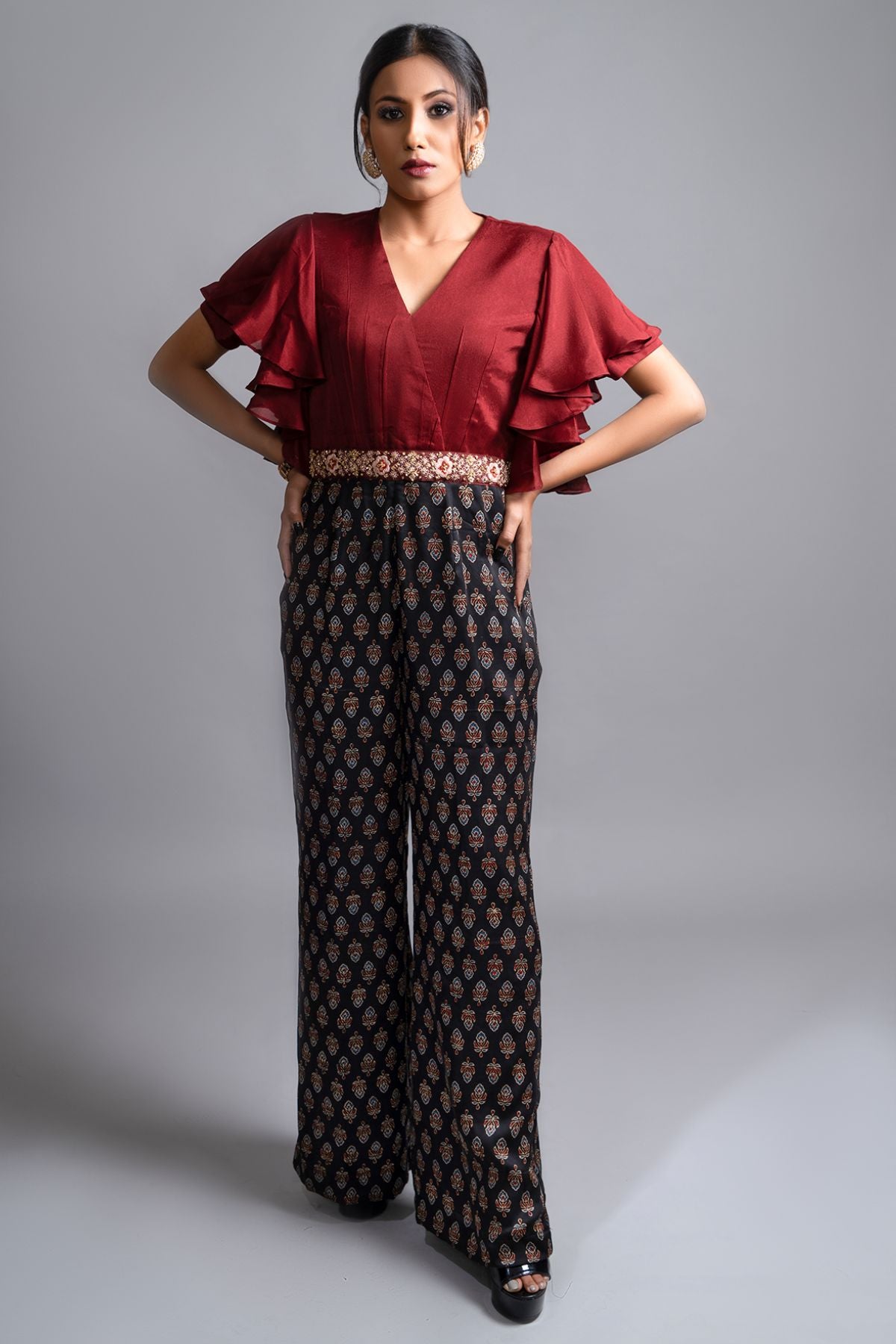 "Effortlessly stylish Jumpsuit in Pure Modal Silk Ajrak Print, featuring a Maroon Crepe Yoke with Intricate Detailing on the Waistband. Shop now for elegance!"