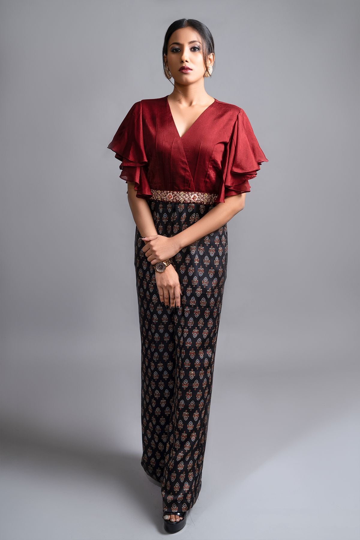 "Effortlessly stylish Jumpsuit in Pure Modal Silk Ajrak Print, featuring a Maroon Crepe Yoke with Intricate Detailing on the Waistband. Shop now for elegance!"