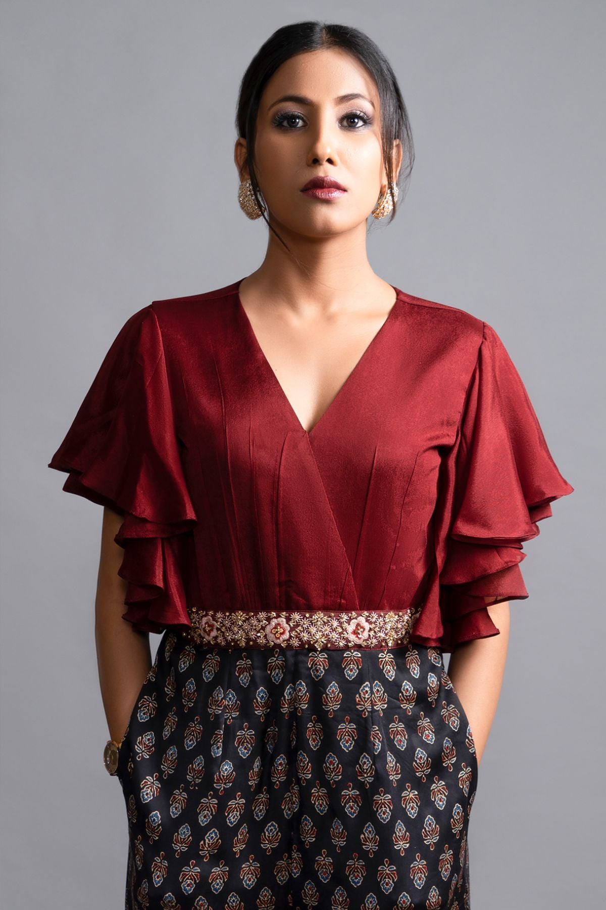 "Effortlessly stylish Jumpsuit in Pure Modal Silk Ajrak Print, featuring a Maroon Crepe Yoke with Intricate Detailing on the Waistband. Shop now for elegance!"