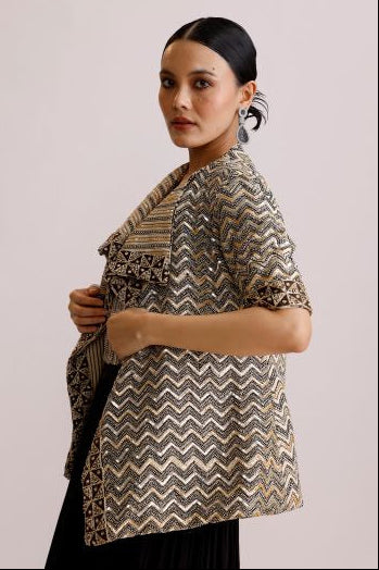 Woman wearing a patterned dress with a plain background