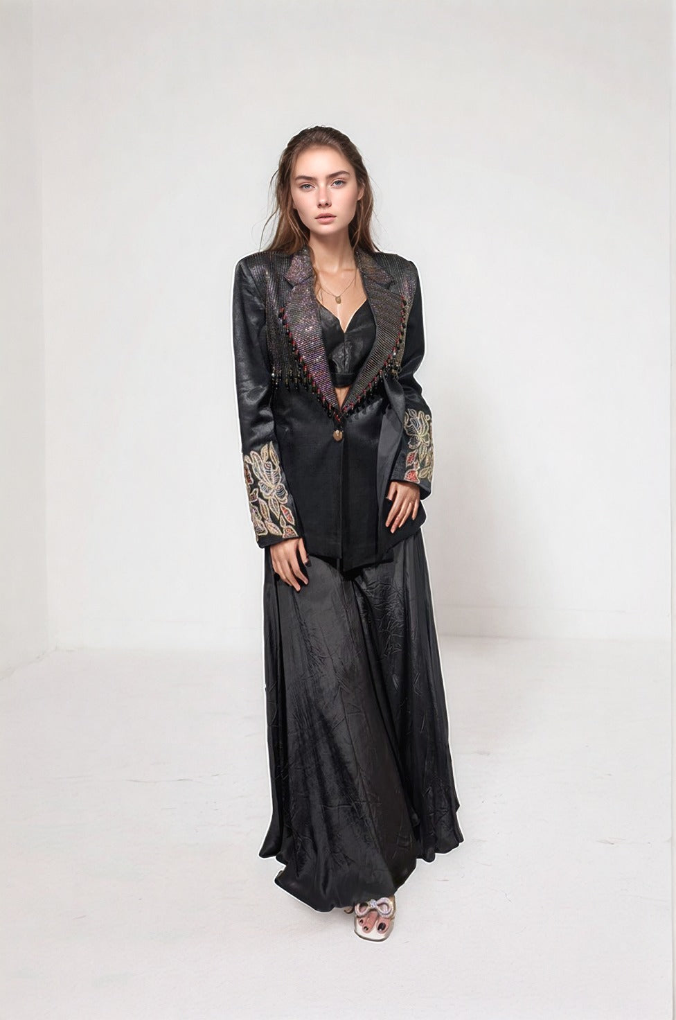 Black blazer paired with bralette and flare pants