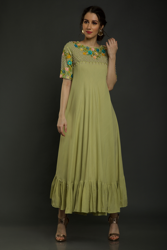 Radiate freshness in our Lime Green Umbrella Dress. Moss crepe with intricate embroidered yoke featuring knot work thread, pearl beads, & cutdana embellishments