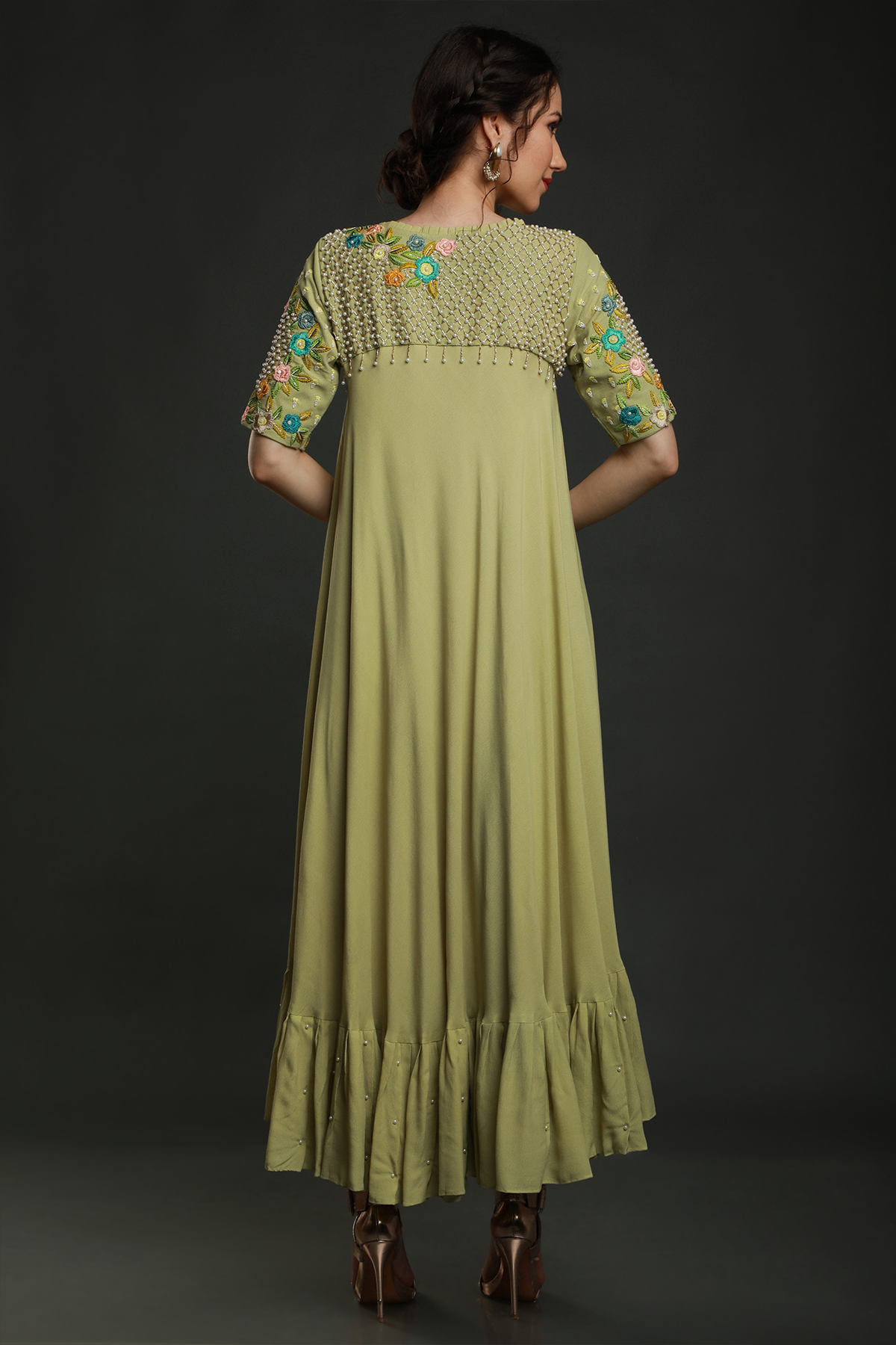 Radiate freshness in our Lime Green Umbrella Dress. Moss crepe with intricate embroidered yoke featuring knot work thread, pearl beads, & cutdana embellishments
