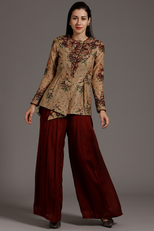 Elevate your style with this Beige & Wine Chanderi peplum Angrakha top and pleated crepe palazzo pants set. Exquisite hand-embroidery adds charm.
