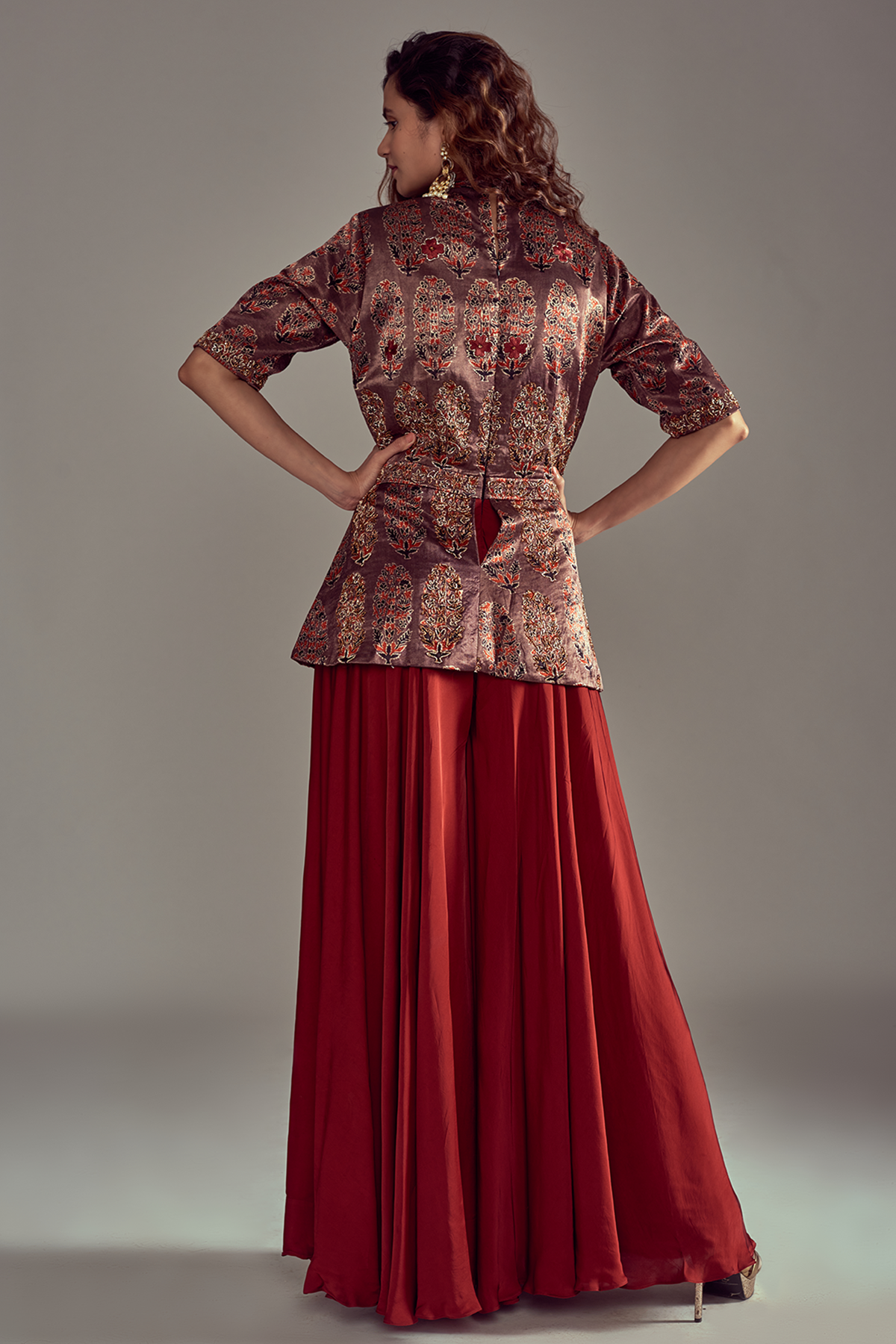 "Stunning Ajrakh printed peplum jumpsuit embellishment with nakshi embroidered in pure mashru silk and pure satin crepe."