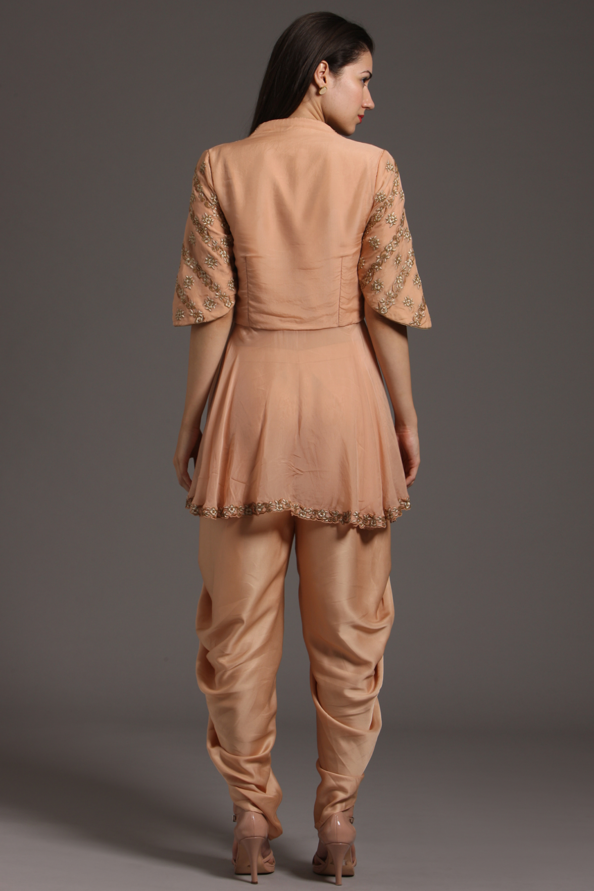 "Graceful Peach Organza Peplum Tunic with Embroidery, paired with Crepe Dhoti Pants. Embrace elegance and shop now for your special occasions."